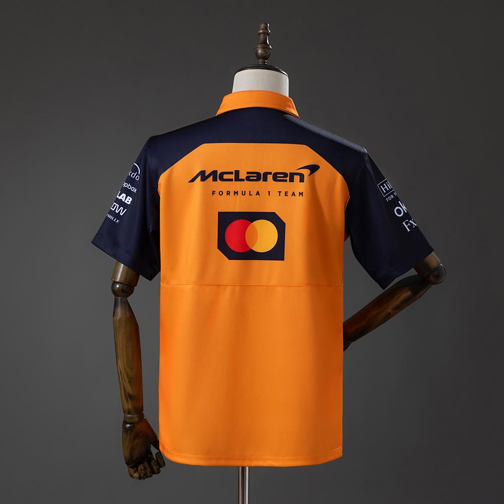 Polo McLaren Racing F1 Naranja y Azul Marino 2025 Adultos